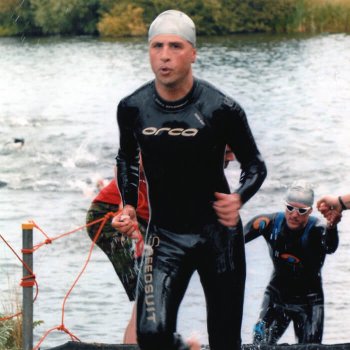 Domenico Buonocore in a black wesuit coming out of a lake